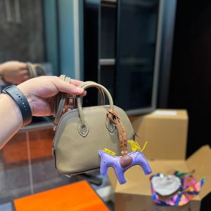 Famous designer mini handbag, shell bag, practical shopping bag for women, cute zero wallet, sweet and compact phone bag, small horse decoration accessories