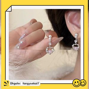 2024 Designer 925 silver needle South Korea's shiny delicate diamond snowflake earrings female fashion exaggerated geometric earrings factory EVOM