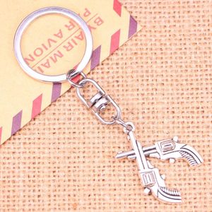 Keychains 20pcs Fashion Keychain 31 23 Mm Crossed Pistols Revolvers Western Pendants DIY Men Jewelry Car Key Chain Souvenir For Gift