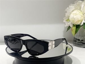 新しいファッションデザインサングラス0095Dダイヤモンド装飾を備えた猫のアイフレームシンプルで人気のあるスタイルの装飾UV400保護メガネ