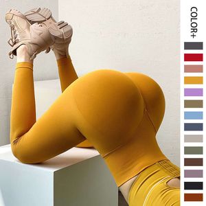 Nya sexiga persika Hip Yoga Pants sömlösa höft upp täta sportbyxor Hög midja Hip Up Fiess Pants for Women