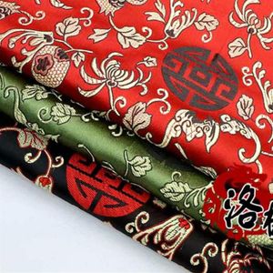 Партневая жаккардовая шелковая атласная костюм китайское платье для одежды детская одежда ткань ткань ткань Дамаска гранат цветы 310t