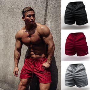 Shorts masculinos masculinos de grife verão malha casual academia musculação exercício fitness homem praia respirável corredor marca treino de secagem rápida