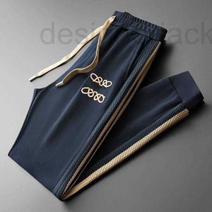 Men's Pants Designer High-end mens sweatpants designer pants autumn lace-up foot protection slacks men women side striped jacquard trousers 0UGW