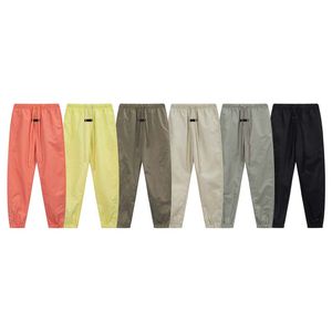 Pantaloni da uomo firmati Pantaloni da donna alla moda con stampa Pantaloni casual da uomo in nylon, pantaloni sportivi alla moda, riflettenti, ad asciugatura rapida