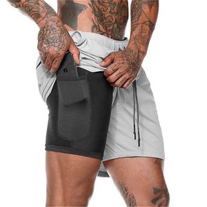 Pantaloncini da uomo Pantaloncini solidi a doppio strato da uomo Pantaloni da corsa veloci per allenamento fitness di grandi dimensioni 230710