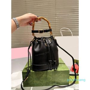 Designer - Kohud Bucket Bag för kvinnor Mini Shoulder Handväska Förvaring Liten Tofs Läder Flickor Dam Messenger Bag