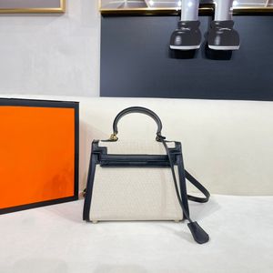 Imported waterproof leather stitching canvas series design women's handbag light luxury retro atmosphere elegant large capacity double compartment