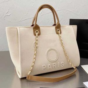 حقائب اليد ذات الحقائب الفاخرة مصممة الأكياس المسائية الحمل CC Pearl Canvas Beach Bag Brandch Handbags Designers Female CARGE LADE LADIAL