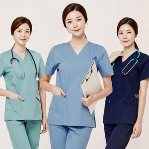 Kvinnors tvåbitar byxor Skönhetssalong Kvinnor Solid Color Uniforms Suits Beautian Female V Neck Working Clothing Dentist CLINC Workwear Set