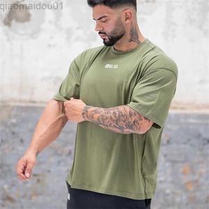 T-shirt da uomo 2022 NUOVE palestre estive t-shirt fitness T-shirt da corsa uomo sciolto O-collo camicia bodybuilding stampa uomo cotone maglietta sportiva L230713