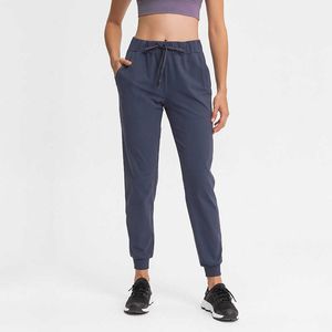 L-133 Kvinnor Yoga Pants High midje Stretch Fitness Trousers Slim Running Sports Joggers Ladies Dance Training Bell-Bottoms