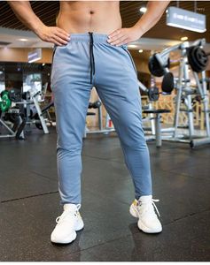 Mäns byxor Autumn Men Breattable Spandex Running Sport Training Gym Sportkläder Elastiska snabba torra utomhusblåsare Sweatpants