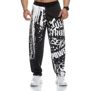 Mens pantolon kas sporları örgü ince gündelik koşu eğitimi gevşek büyük pantolon hip hop baskılı 230718