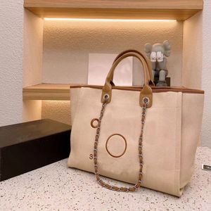 Летняя дизайнерская пляжная сумочка C буква на плече флеш -офис высококачественный классический пакет Canvas с Button Retro Women's Bagbag Lassic Anvas Bag 92