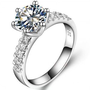 Utmärkt 2CT Brilliant Synthetic Diamond Wedding Ring för kvinnlig solid sterlingsilverring med vitt guldtäckning267z