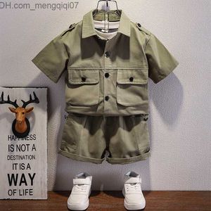 Completi di abbigliamento Abbigliamento per ragazzi in stile occidentale pantaloncini estivi camicia verde militare abbottonata bavero abiti da lavoro multitasche set per bambini età 2-8 Z230719