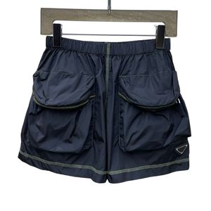 23SS Feminino Shorts de grife com letras Triângulo Sinal Padrão Sofisticado Milan Runway Marca Casual Mini Jersey Jogging Outwear A-line Pocket Hotty Hot Pants Activewear