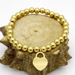 Marchio originale TFF Bracciale con cuore color pesca con decorazione a mano in oro, catena con perline rotonde, gioielli da donna in acciaio al titanio
