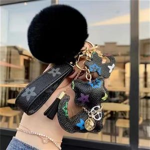 Luxury designer L Keychain Men Women Fashion Cat and deer flower Bag Pendant Accessories Cute Carabiner Keychains Lovers Car Keys 268I