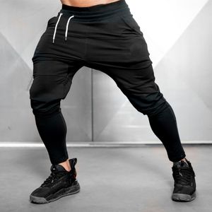 Erkek pantolon katı siyah jogger pantolon spor salonları eşofmanlar erkekler rahat pamuk iz parçaları sonbahar pantolonlar erkek fitness egzersiz spor giyim dipleri 230720