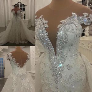 Blygsamma sjöjungfru bröllopsklänningar med löstagbar kjol som lyser paljetter kristallpärlor applikationer ren nacken rygglös lång brudklänning294o