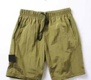 Pantaloncini estivi da spiaggia 2023 Pantaloni corti da uomo Moda da corsa Sciolto Processo di lavaggio ad asciugatura rapida di tessuto puro Trendy Casual Hip-hop Ins Stones Motion current 645ess