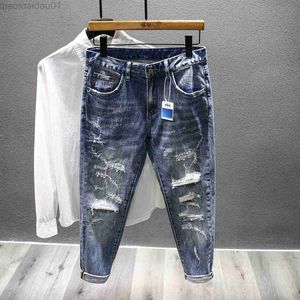 Jeans da uomo 2023 Jeans da uomo strappati primaverili New Fashion Baffi Retro Patch Hole Trend Slim Streetwear Jeans con piedini Pantaloni in denim L230724