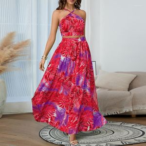 Kjolar moster kvinnors sommartryck rem öppen bakre topp hög midja stor sväng halv kjol set elegant ärmlös urban stil