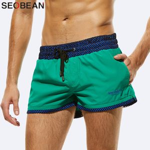 Calções masculinos de secagem rápida moda mar maillot de bain shorts de praia bermudas sexy shorts de náilon liso masculino curto