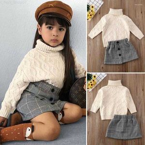 Kläduppsättningar Kläduppsättningar 3-7 år Kids Baby Girl Winter Clothes Solid Sticked Plaid-knapp Kort kjol Turtleneck Knit Sweater Mini Outfit Z230726