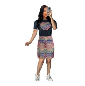 J2882 vestido feminino europeu americano de duas peças verão nova blusa com gola redonda posicionamento saia estampada terno