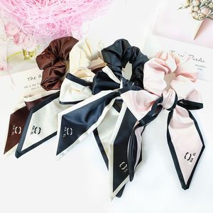 10 Stile Misto Invia Designer Lettere Stampa Fiori Bowknot Intestino crasso Legami per capelli Corda Donna Scrunchies Fasce per capelli Elastici Elastici Porta coda di cavallo Copricapo