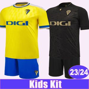 2023 24 Cadiz Kids Kit Camisas de futebol LOZANO ALEX I. ALEJO A. NEGREDO A. ESPINO Home Away Criança Terno Camisas de futebol
