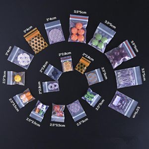 100pcs partia małe kreskówkowe przezroczyste przezroczyste worka ziplock wielokrotnego użytku pokarm zamek błyskawiczny Pill Button Poszukiwanie w proszku torebki