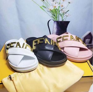 Slippers and sandals with boxes Black leather flip-flops are equipped with high-quality wide cross straps made of white and sandals decorated with gold metal letters.