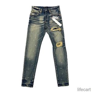 Дизайнерские фиолетовые джинсы Мужские джинсы мужская главная уличная одежда для вышивших брюк Женские негабаритные разбитые патч -отверстия Джинсовая джинсовая джинсовая ткань Стрим URC7