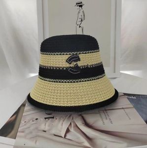 Cappello da pescatore a righe casual all'ingrosso Cappello di paglia intrecciato all'ingrosso Fai sembrare il viso più piccolo Cappello da pescatore di moda con protezione solare da spiaggia