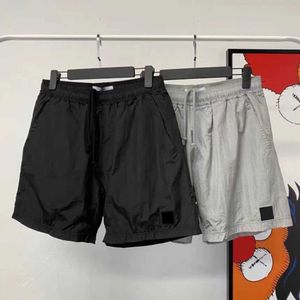 Calça masculina shorts designer nado de pista curta de verão praia de verão com suéter lateral de bolso lateral corredores unissex outwears size m-2xlknmr