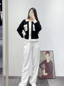 Maje's new black and white lapel metal button knitted cardigan jacket