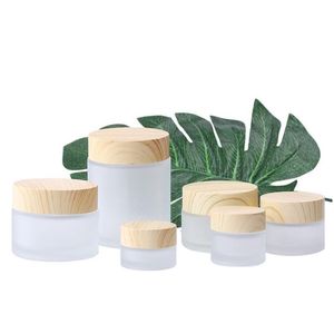 Förpackningsflaskor Partihandel Frosted Glass Jar Cream Flaskor Runt kosmetiska burkar Hand ansikte Packning Bottle 5G 50G burk med träkorn ER DH8M5