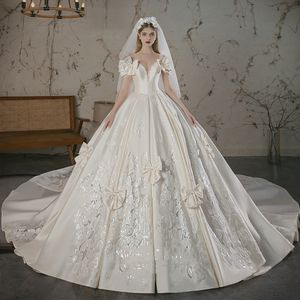 Luksusowe dubaj suknia balowa suknie ślubne długie zroszony przezroczysty kryształ szyi kryształ zroszony Appliqued suknie ślubne koronki plama cekinami projektant Vestido De Novias