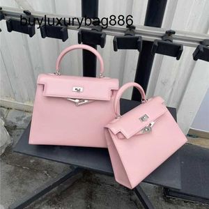 Bolsas femininas 2023 nova bolsa de couro genuíno feminina moda e simples sensação avançada portátil conhecimento de embarque ombro crossbody