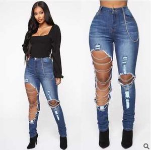 Pantaloni piccoli piedi in cotone elastico con catenella da donna in jeans strappati primaverili Q231106