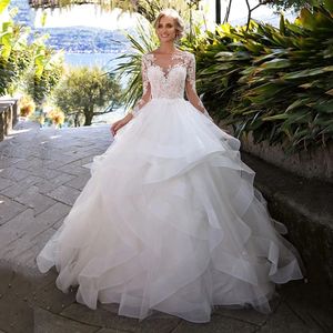 Księżniczka suknia balowa suknia ślubna Sheer szyi długie rękawy koronkowe aplikacje suknie ślubne bez pleców falbany spódnica vestidos de noiva