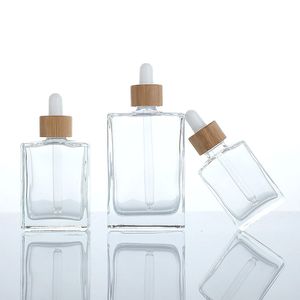 フラットスクエア長方形の贅沢15ml 30ml 50ml 100ml 100ml 4オンスガラスドロッパーボトルと血清エッセンシャルオイル用の竹ドロッパーキャップ付き