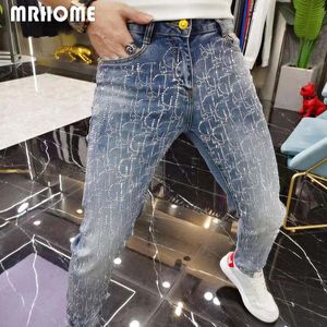 Luksusowe pełne logo Rhinestone męskie dżinsy moda ciężki proces męskie obcisłe spodnie ołówkowe odzież przez cały sezon Trend wysokiej jakości męskie spodnie jeansowe 28-38