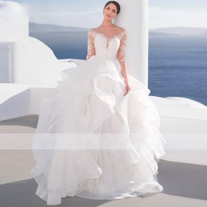 Beautiful Ruffles Ball Gown Wedding Dresses Illusion Scoop Neck Beach Bridal Gown Cascading Tiere Wedding Gown with Long Sleeve