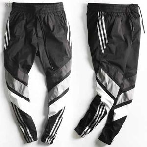 Men's Pants New Spring Summer Sports Pants Men Tooling Pants Male Beam Feet Male Youth Version Closing Feet Nine Points Pants Casual Pant M230408
