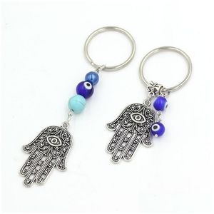 Kluczowe pierścionki Hurtownia Lucky Hamsa Fatima ręka Klucz pierścionki kluczyek Kluczowy samochód Keyring Niebieski turecki łańcuch oka złego dla kobiet biżuteria dhgarden dhwkd